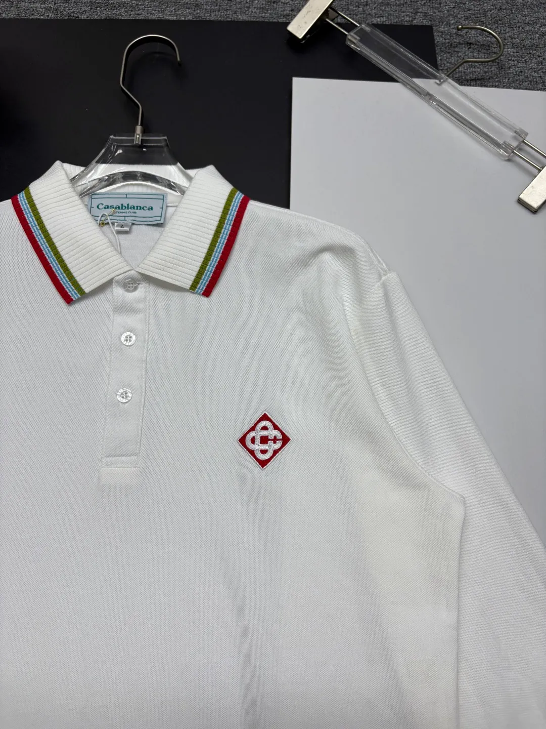 CASABLANCA New Arrival embroidered long-sleeved Polo shirt. Original fabric. Official Same Style. Made of pure cotton pique fabric, customized in the same vat. It feels very comfortable and smooth. The version is very wide and stylish. Produced by the first-line brand Factory. Imported Behringer embroidery machine. The embroidery is full and textured. The collar rib is woven with imported yarn. It will not deform after long-term wear. The most New Arrival style in spring and summer. Fashionable and individual. Super Versatile and good-looking. It is very suitable for both men and women. It is a must-have for everyone. Color: Black White Blue Size: M-3XL